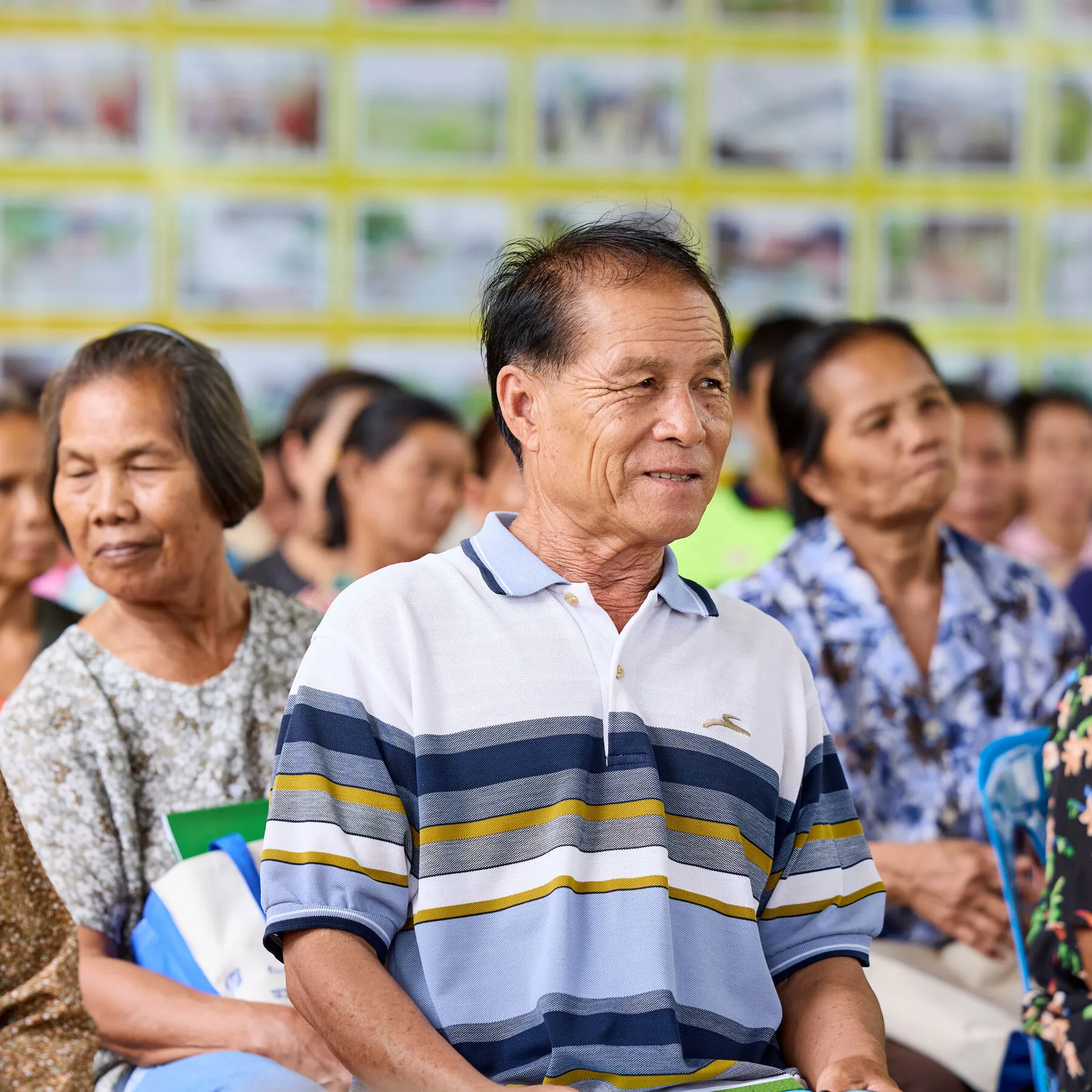 Farmers who grow rice for Westmill Foods attend an agricultural training session at a local temple, Ubon Ratchathani, Thailand