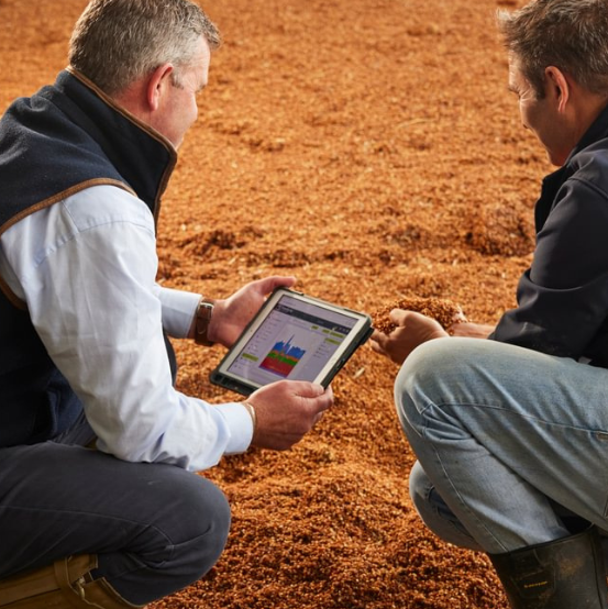 One of our AB Agri consultants with a client farmer on their farm in Somerset, UK