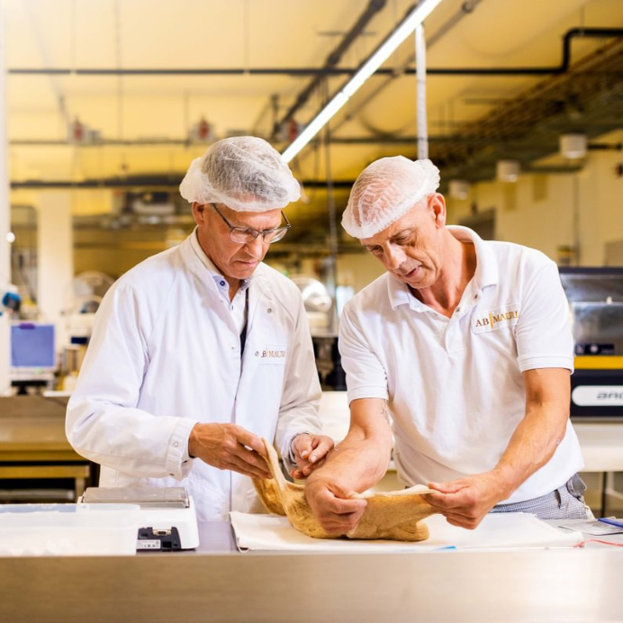 AB Mauri employees carrying out a quality check on dough at our Global Technology Centre, Etten-Leur, Netherlands