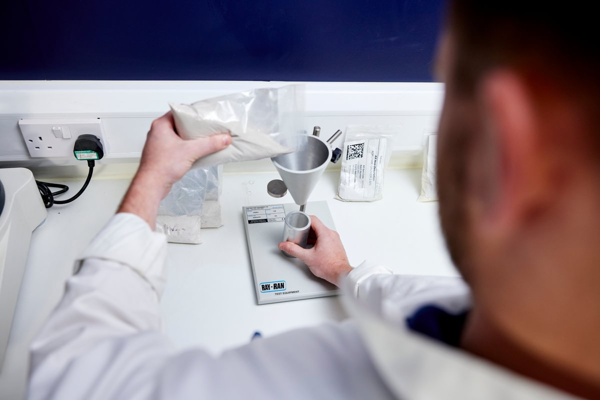 A quality technician testing product at Premier Nutrition's lab in Fradley, UK