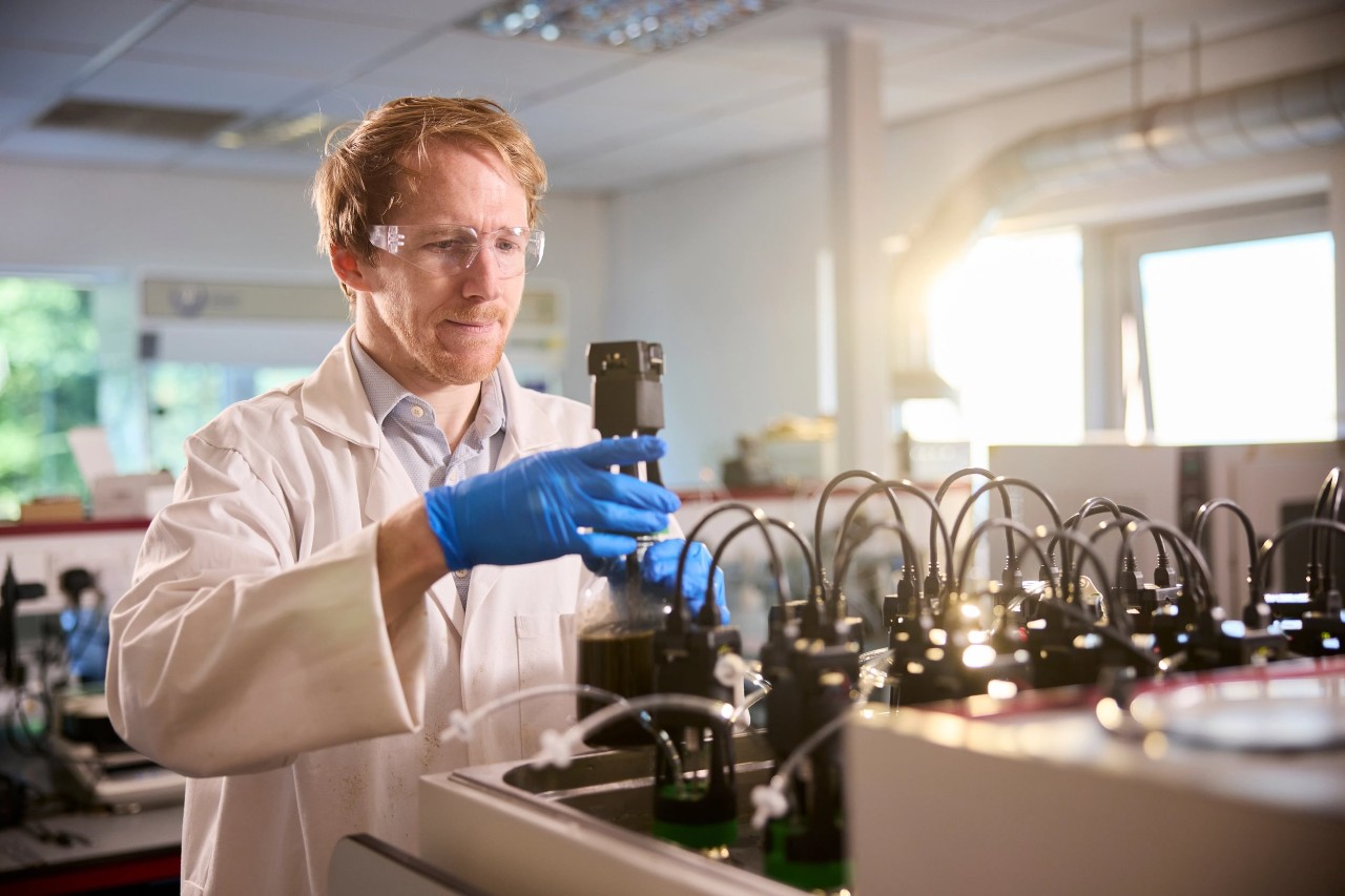Colleague testing feedstock sample at Amur Energy lab in York, UK