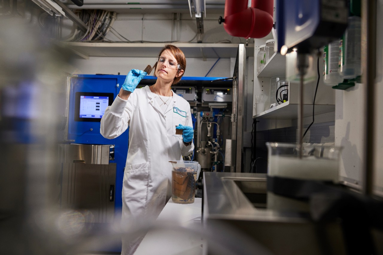 Lab colleague testing enzymes for pulp and paper at AB Enzymes, Finland 