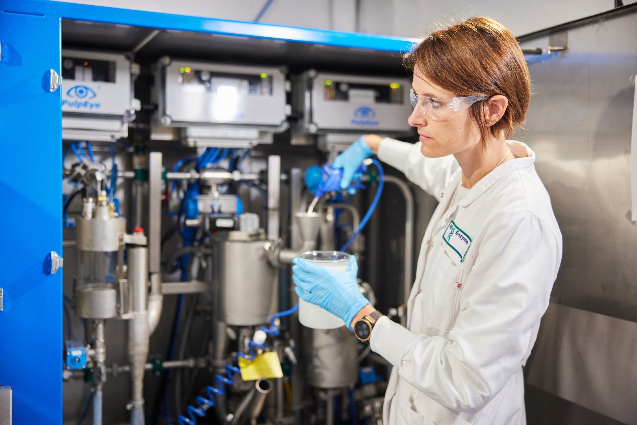 Lab colleague testing enzymes for pulp and paper at AB Enzymes, Finland