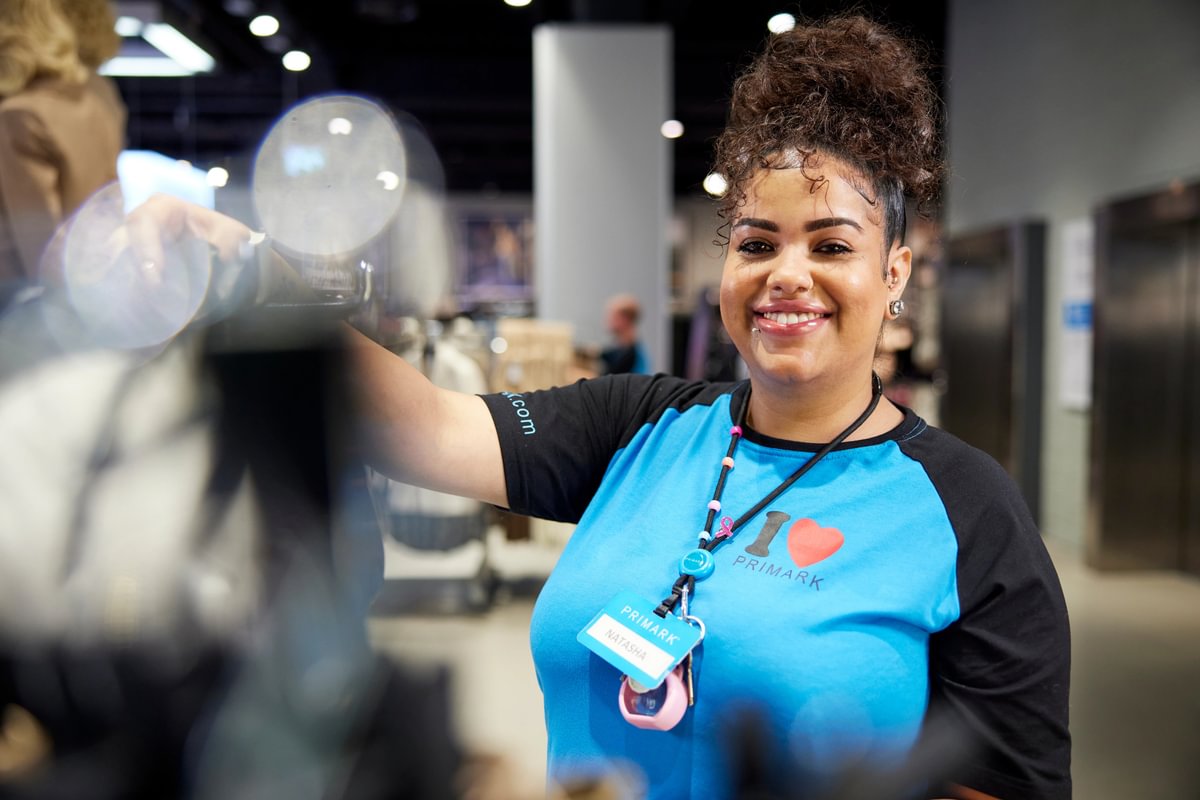 A colleague at Primark's Oxford Street East store, London, UK