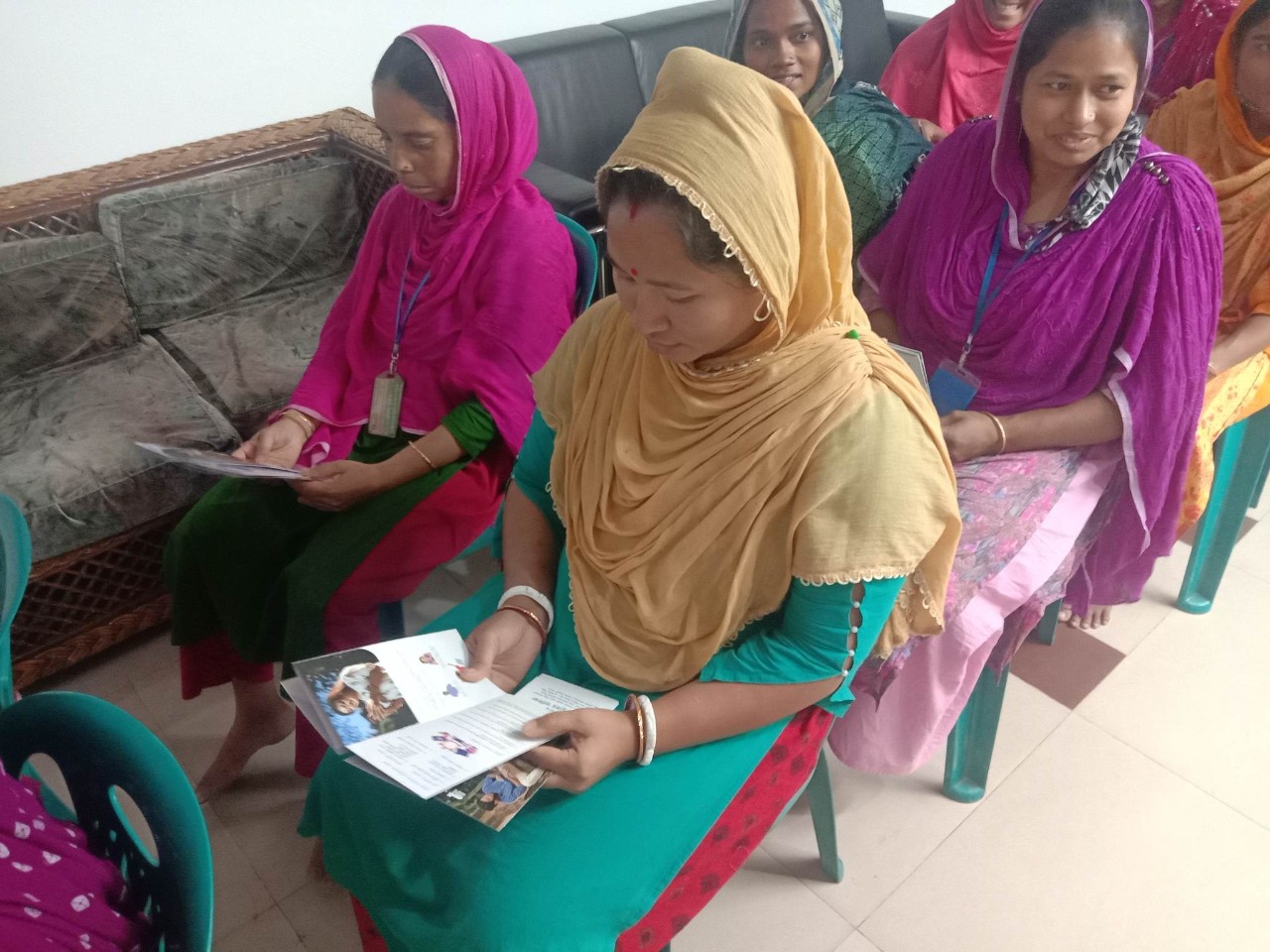 Factory workers undergoing training on mental health in the workplace
